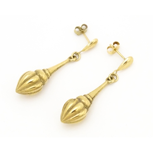 678 - A pair of yellow metal drop earrings. Approx  1 1/2