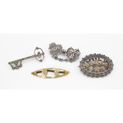 682 - Four assorted brooches to include 2 Victorian silver examples, one titled Mizpah.  Each approx 1 3/4... 