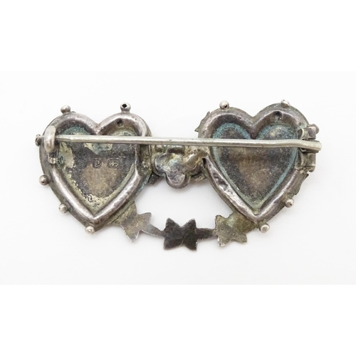 682 - Four assorted brooches to include 2 Victorian silver examples, one titled Mizpah.  Each approx 1 3/4... 