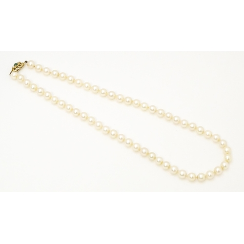 709 - A pearl necklace with 9ct gold clasp. Approx 16