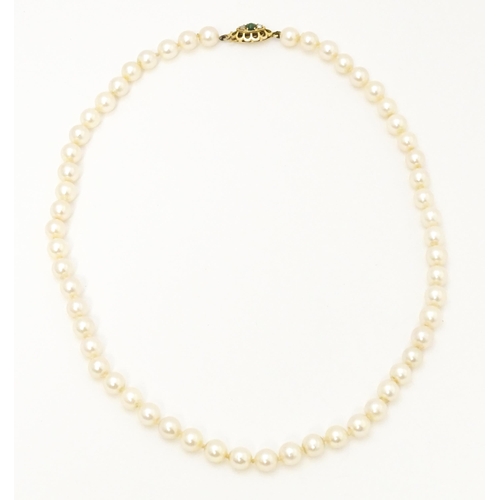 709 - A pearl necklace with 9ct gold clasp. Approx 16