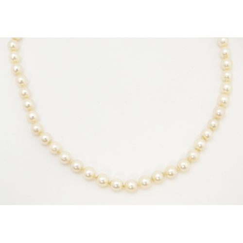 709 - A pearl necklace with 9ct gold clasp. Approx 16