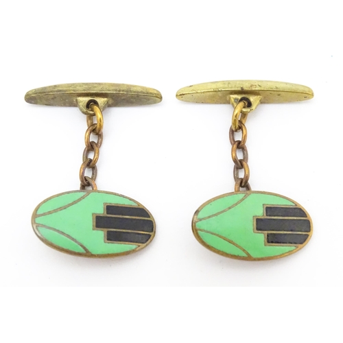 747 - A pair of gilt metal cufflinks with Art Deco enamel decoration.