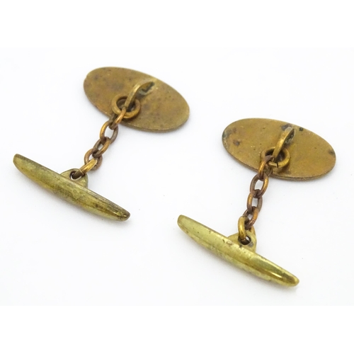 747 - A pair of gilt metal cufflinks with Art Deco enamel decoration.