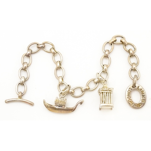 756 - A silver bracelet by Links of London with two charms. Bracelet approx. 7 1/2