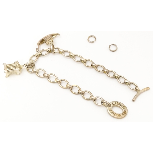 756 - A silver bracelet by Links of London with two charms. Bracelet approx. 7 1/2