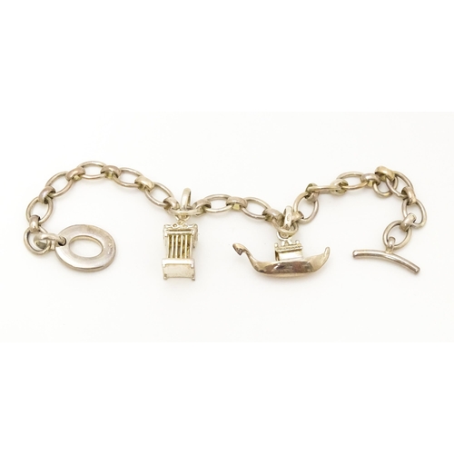 756 - A silver bracelet by Links of London with two charms. Bracelet approx. 7 1/2