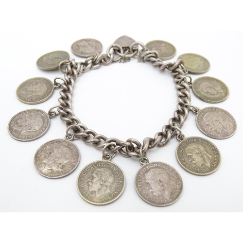 760 - A silver bracelet set with various George V and Edward VI coins