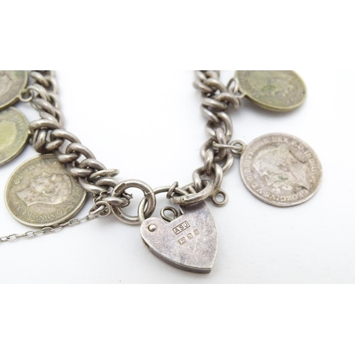 760 - A silver bracelet set with various George V and Edward VI coins