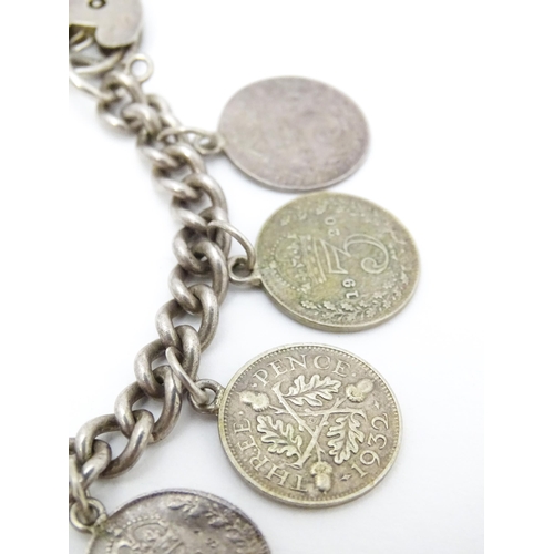 760 - A silver bracelet set with various George V and Edward VI coins