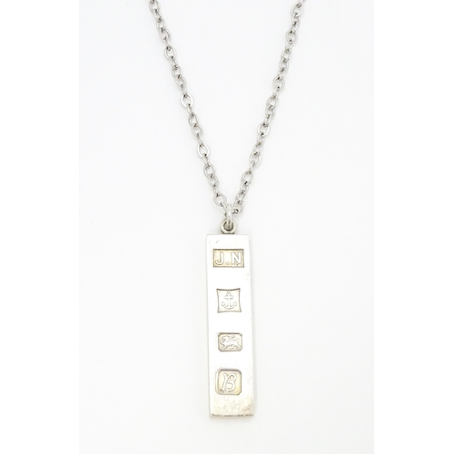 763 - A silver pendant of ingot form hallmarked Birmingham 1976, maker J.N. Approx. 1 3/4