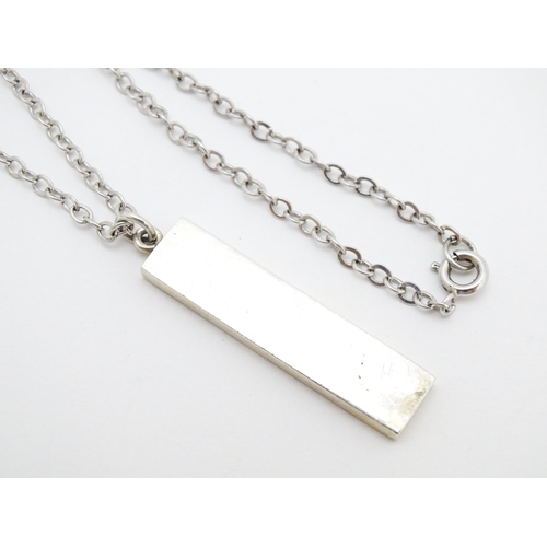 763 - A silver pendant of ingot form hallmarked Birmingham 1976, maker J.N. Approx. 1 3/4