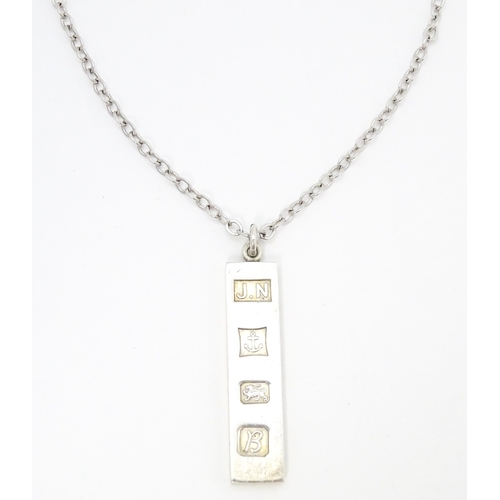 763 - A silver pendant of ingot form hallmarked Birmingham 1976, maker J.N. Approx. 1 3/4