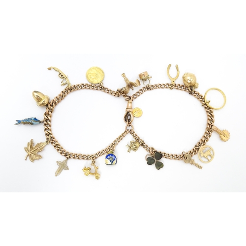 764 - A 9ct gold twin chain charm bracelet set with various 9ct gold and yellow metal charms to include a ... 