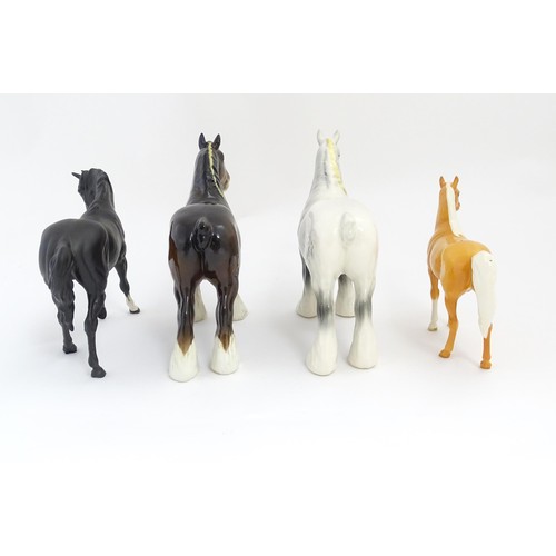 120 - Four Beswick models of horses comprising a brown Shire Mare and a dapple grey Shire Mare model no. 8... 