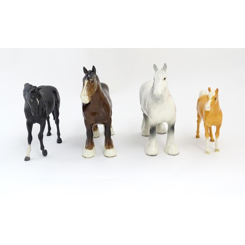 120 - Four Beswick models of horses comprising a brown Shire Mare and a dapple grey Shire Mare model no. 8... 