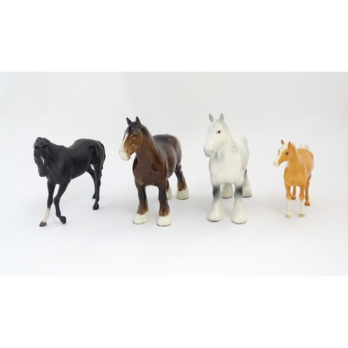 120 - Four Beswick models of horses comprising a brown Shire Mare and a dapple grey Shire Mare model no. 8... 