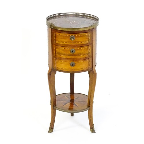 1437 - An early 20thC marble topped side table, with a pierced brass upstand above three short drawers with... 