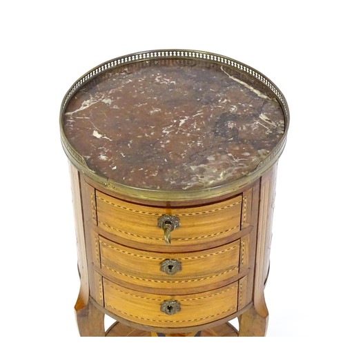 1437 - An early 20thC marble topped side table, with a pierced brass upstand above three short drawers with... 