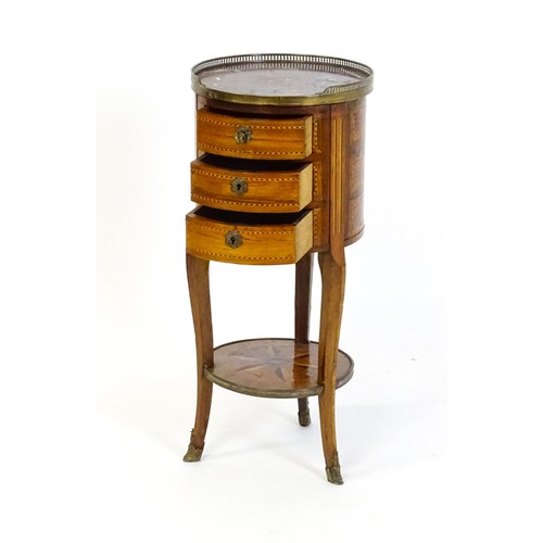 1437 - An early 20thC marble topped side table, with a pierced brass upstand above three short drawers with... 