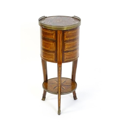 1437 - An early 20thC marble topped side table, with a pierced brass upstand above three short drawers with... 