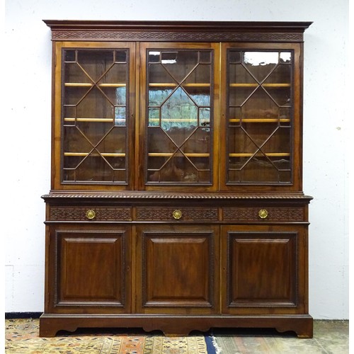 1438 - A late 19thC mahogany glazed bookcase by S & H Jewell, Queen Street, London. The cornice with blind ... 