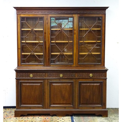 1438 - A late 19thC mahogany glazed bookcase by S & H Jewell, Queen Street, London. The cornice with blind ... 