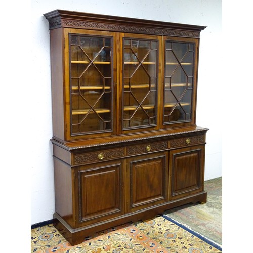 1438 - A late 19thC mahogany glazed bookcase by S & H Jewell, Queen Street, London. The cornice with blind ... 