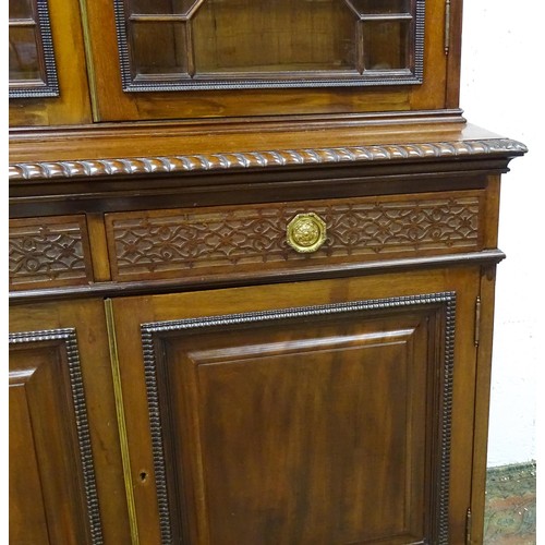 1438 - A late 19thC mahogany glazed bookcase by S & H Jewell, Queen Street, London. The cornice with blind ... 