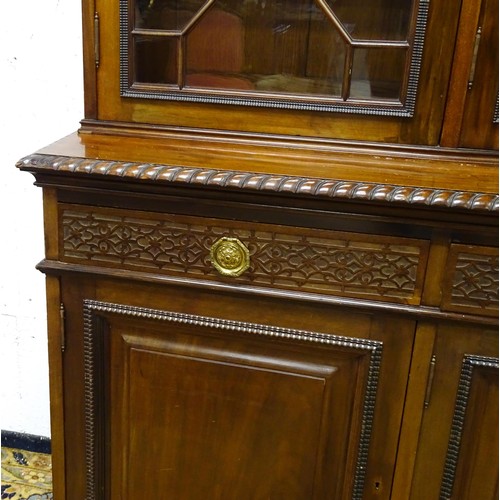 1438 - A late 19thC mahogany glazed bookcase by S & H Jewell, Queen Street, London. The cornice with blind ... 