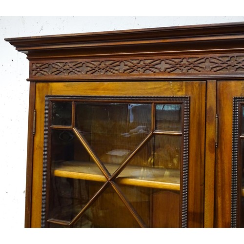 1438 - A late 19thC mahogany glazed bookcase by S & H Jewell, Queen Street, London. The cornice with blind ... 