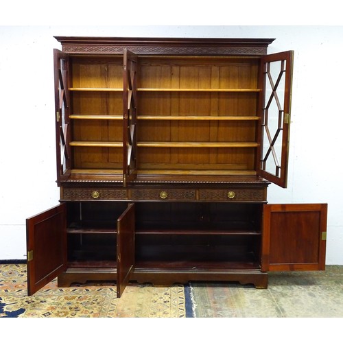 1438 - A late 19thC mahogany glazed bookcase by S & H Jewell, Queen Street, London. The cornice with blind ... 