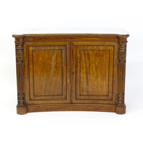 1440 - A 19thC mahogany marble topped sideboard of concave form, the marble top matching the castellated fr... 