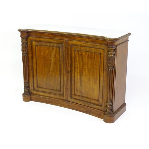 1440 - A 19thC mahogany marble topped sideboard of concave form, the marble top matching the castellated fr... 