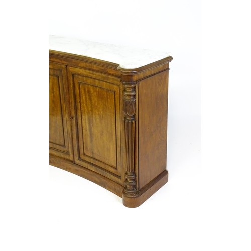 1440 - A 19thC mahogany marble topped sideboard of concave form, the marble top matching the castellated fr... 