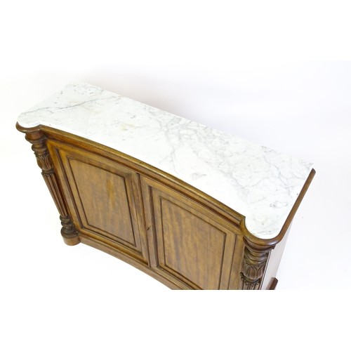 1440 - A 19thC mahogany marble topped sideboard of concave form, the marble top matching the castellated fr... 