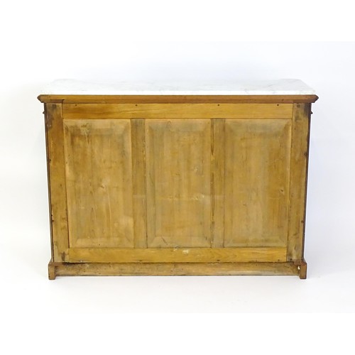 1440 - A 19thC mahogany marble topped sideboard of concave form, the marble top matching the castellated fr... 