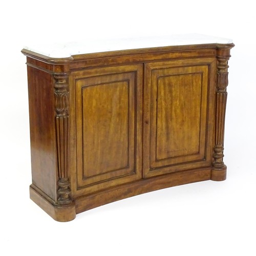 1440 - A 19thC mahogany marble topped sideboard of concave form, the marble top matching the castellated fr... 