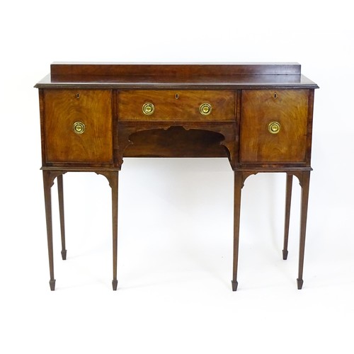 1445 - A 19thC mahogany sideboard, having a raised upstand above a moulded top edge and small central drawe... 