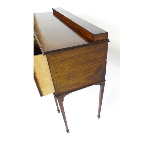 1445 - A 19thC mahogany sideboard, having a raised upstand above a moulded top edge and small central drawe... 