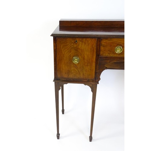 1445 - A 19thC mahogany sideboard, having a raised upstand above a moulded top edge and small central drawe... 