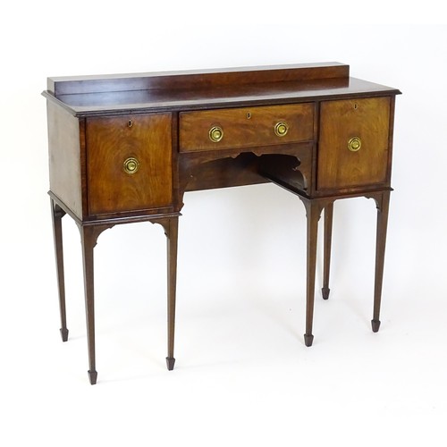 1445 - A 19thC mahogany sideboard, having a raised upstand above a moulded top edge and small central drawe... 