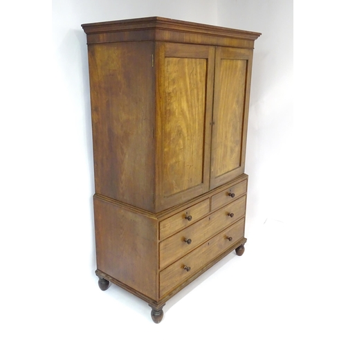 1459 - An early 19thC mahogany Gillows linen press with a moulded cornice above four slides and the base co... 