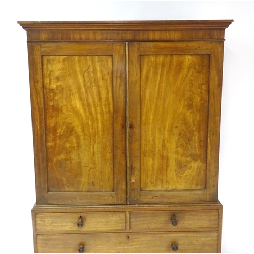 1459 - An early 19thC mahogany Gillows linen press with a moulded cornice above four slides and the base co... 