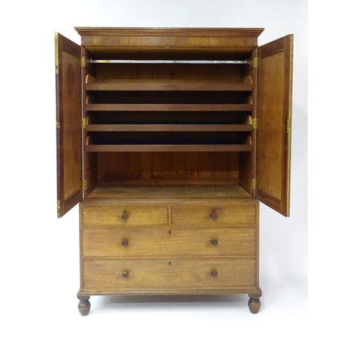 1459 - An early 19thC mahogany Gillows linen press with a moulded cornice above four slides and the base co... 