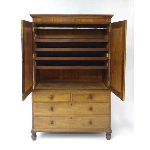 1459 - An early 19thC mahogany Gillows linen press with a moulded cornice above four slides and the base co... 