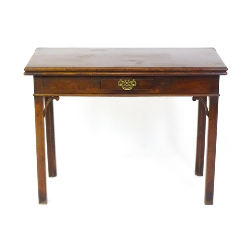 1490 - A late 18thC mahogany tea table with a hinged folding top above a small frieze drawer with a pierced... 