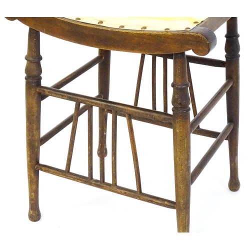 1494 - An early 20thC Aesthetic style stool in the Liberty style, with a concave top above four turned tape... 