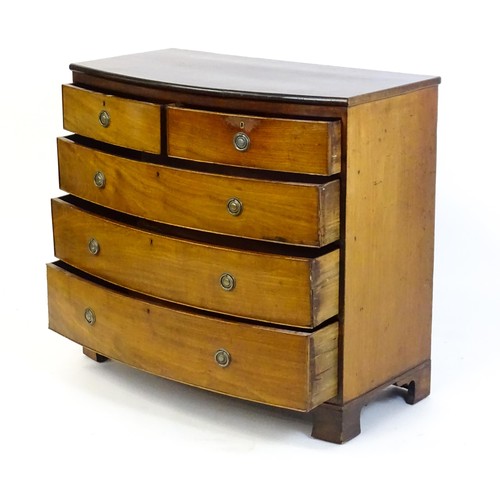 1495 - A late 19thC mahogany bow fronted chest of drawers with two short over three long graduated drawers ... 