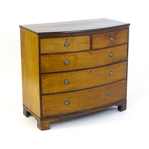 1495 - A late 19thC mahogany bow fronted chest of drawers with two short over three long graduated drawers ... 